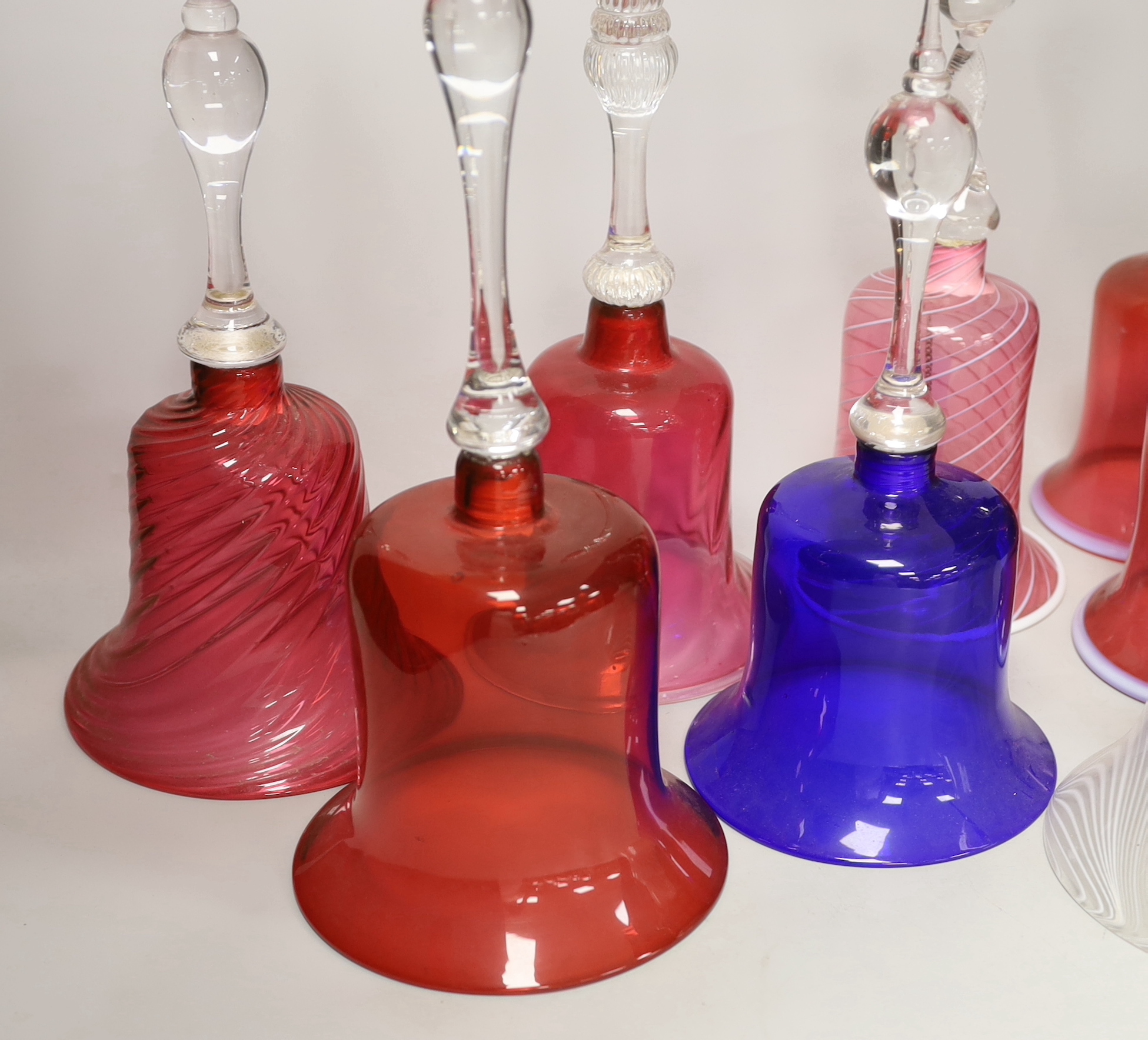 Eight Victorian coloured glass hand bells, tallest 34cm